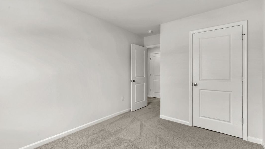 Spacious, unfurnished interior of a new home in The Townes at Wilson's Ridge, Smithfield (Image 24).