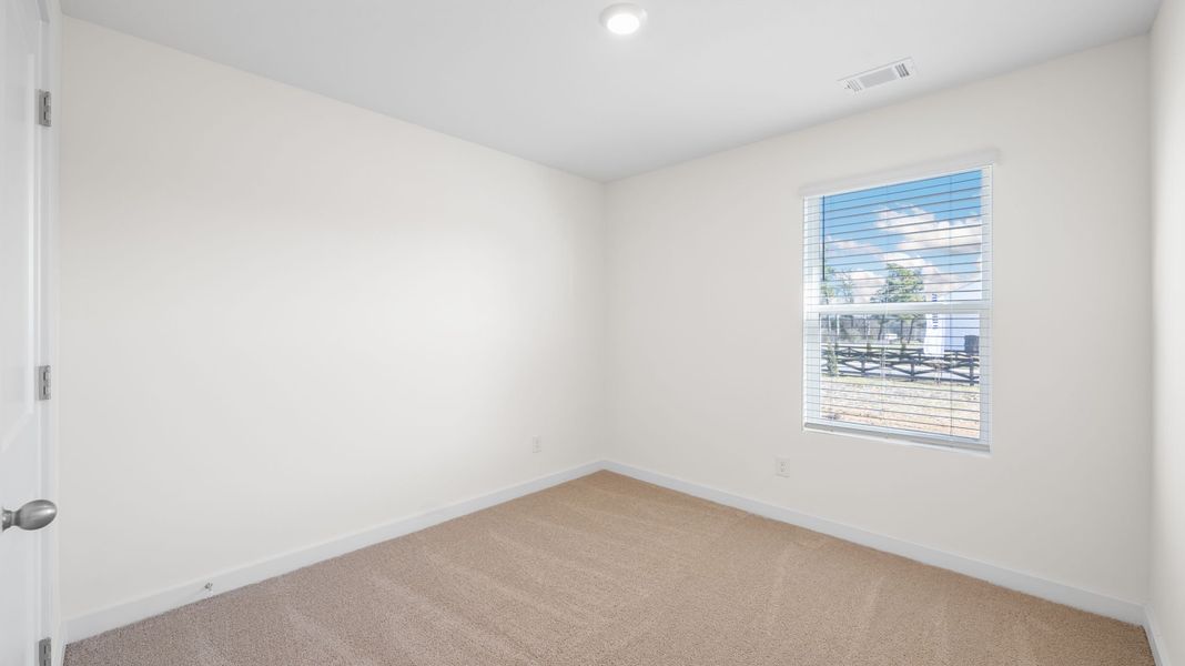 Representative unfurnished interior of a home built from the Sullivan by D.R. Horton in Evergreen Landing, Rossville (Image 12).