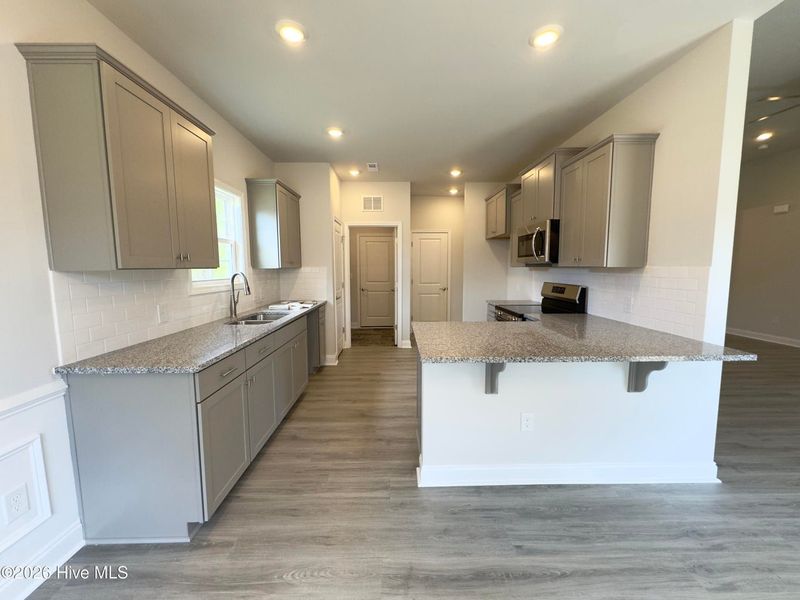 Furnished interior view inside a new home in East Lake, Leland (Image 5).