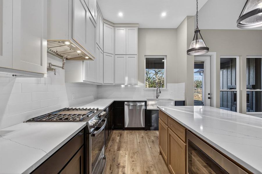 Alternate kitchen angle shows the beautiful quartz countertops and view from the kitchen sink!
