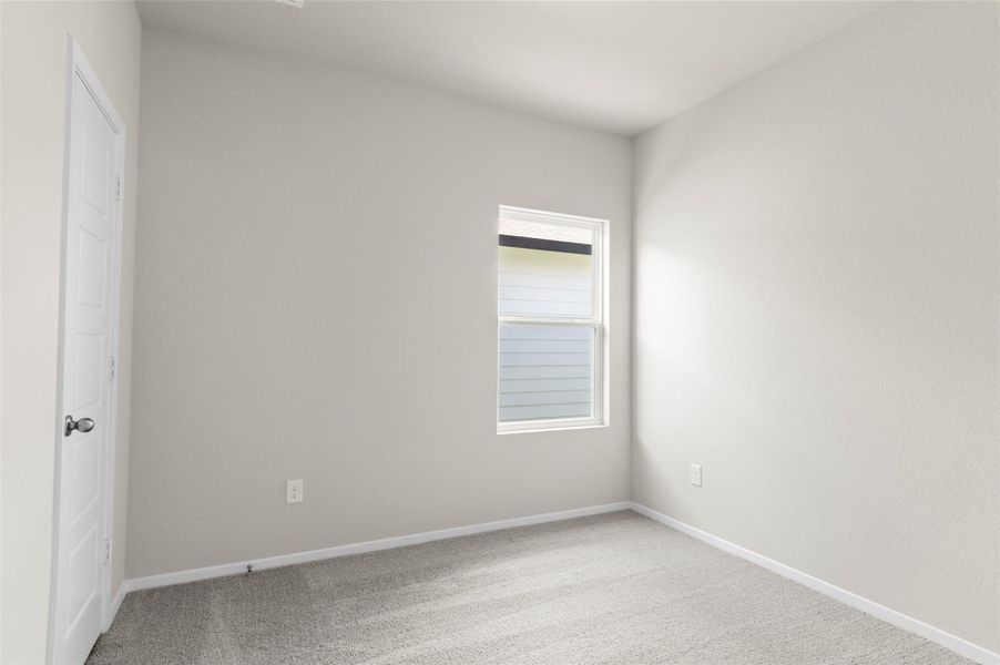 Spare room with carpet and baseboards Spare room with carpet and baseboards