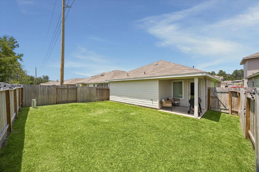 Exterior details and patio area of a home in , Spring (Image 23).