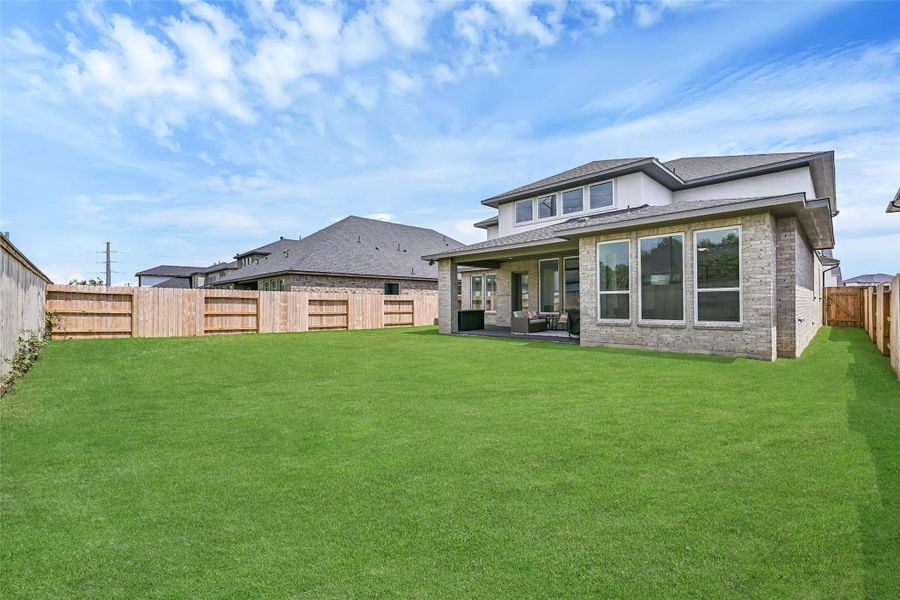 Exterior details and patio area of a home in Avalon at Friendswood, Friendswood (Image 28).