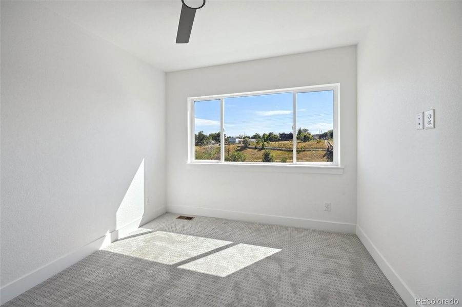 Third bedroom on third floor, with adjacent full bath