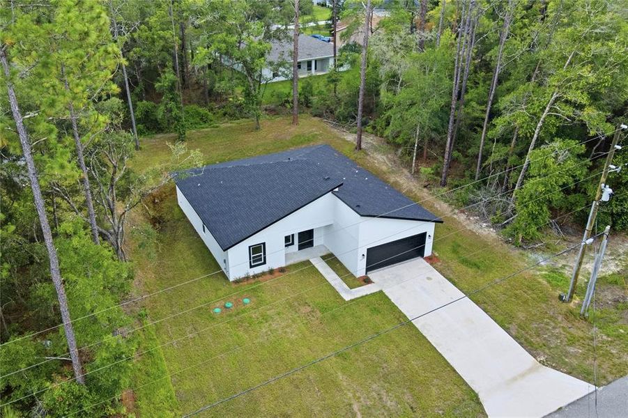 Front exterior of a new home in , Dunnellon, FL, highlighting curb appeal (Image 18).