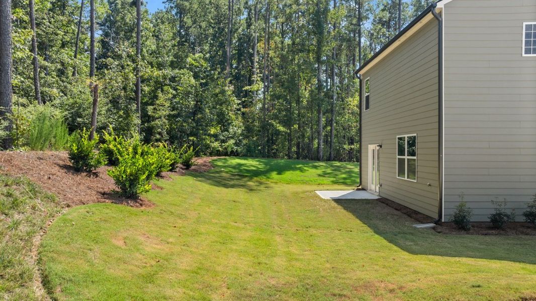 Representative exterior photo of a completed home built from the AISLE by D.R. Horton in Pointe Park, Union City, GA (Image 22).