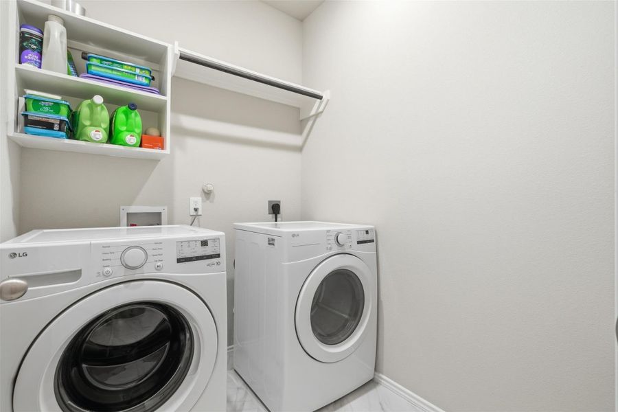 Well-appointed utility room with additional storage space. Well-appointed utility room with additional storage space.