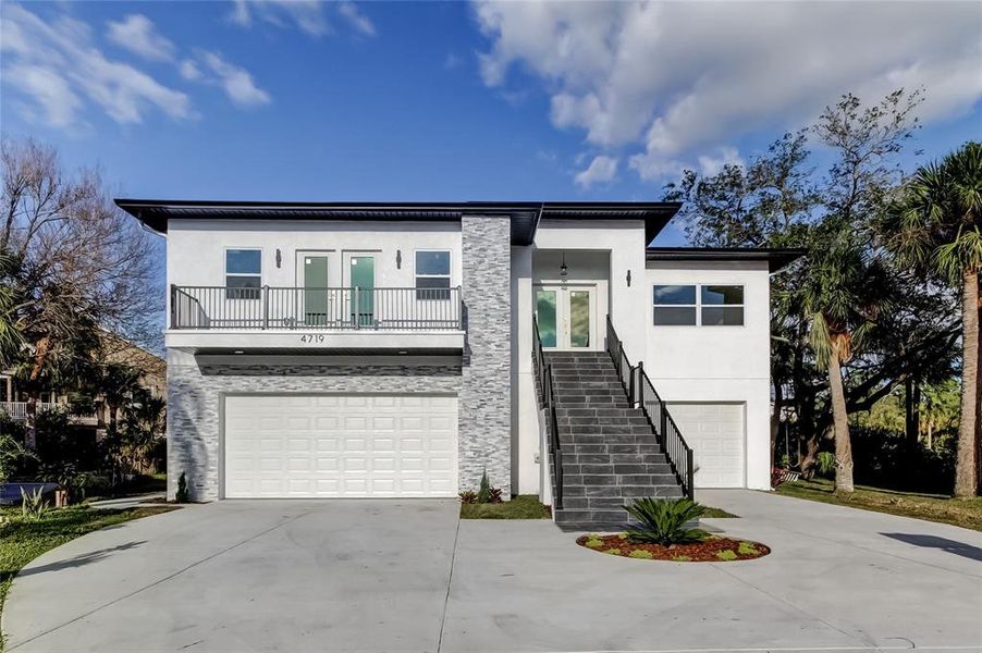 Front exterior of a new home in , New Port Richey, FL, highlighting curb appeal (Image 28).