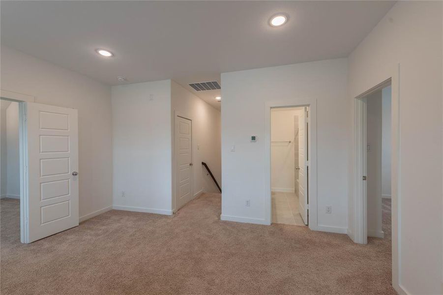 Hall with baseboards and wood finished floors