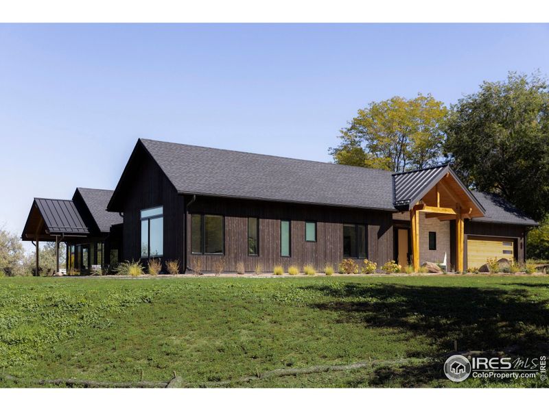 Raised garden beds, lush lawn, and xeriscape landscaping enrich the 0.7-acre setting, while a gravel perimeter and integrated fire suppression system provide both beauty and peace of mind. Raised garden beds, lush lawn, and xeriscape landscaping enrich the 0.7-acre setting, while a gravel perimeter and integrated fire suppression system provide both beauty and peace of mind.