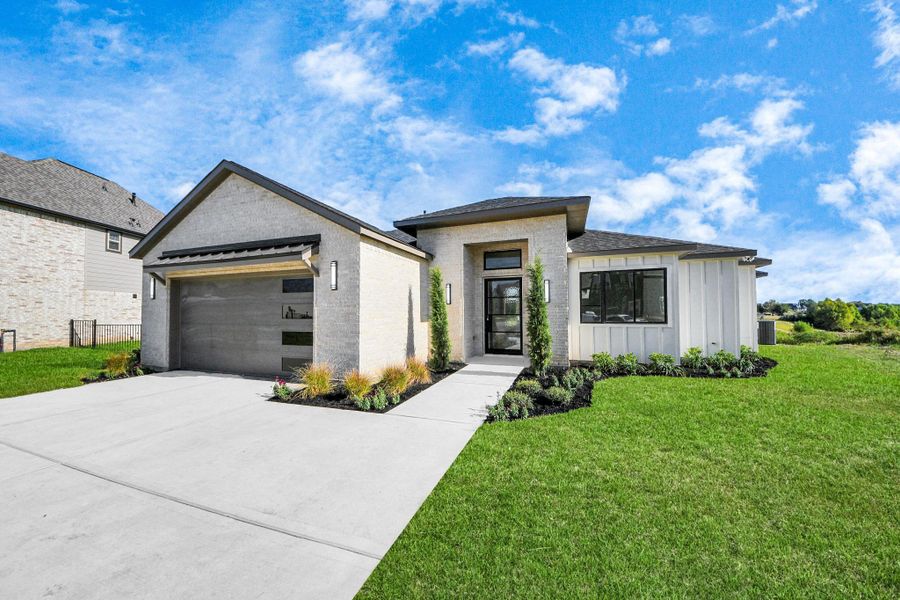 Front exterior of a new home in , Montgomery, TX, highlighting curb appeal (Image 2). Front exterior of a new home in , Montgomery, TX, highlighting curb appeal (Image 2).