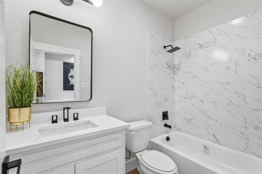 Full bathroom featuring bathing tub / shower combination and vanity