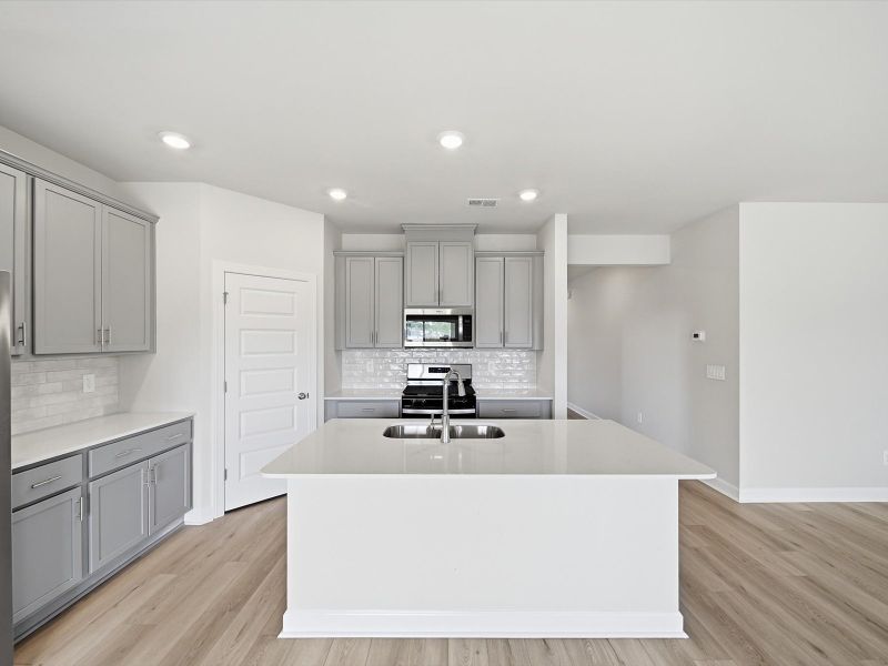 Furnished interior view inside a new home in The Farm at Wells Creek - Signature Collection, Gray Court (Image 3). Furnished interior view inside a new home in The Farm at Wells Creek - Signature Collection, Gray Court (Image 3).