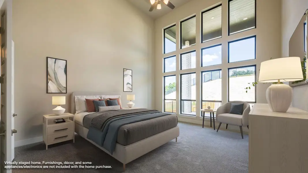 Bedroom featuring carpet, multiple windows, and a towering ceiling Bedroom featuring carpet, multiple windows, and a towering ceiling