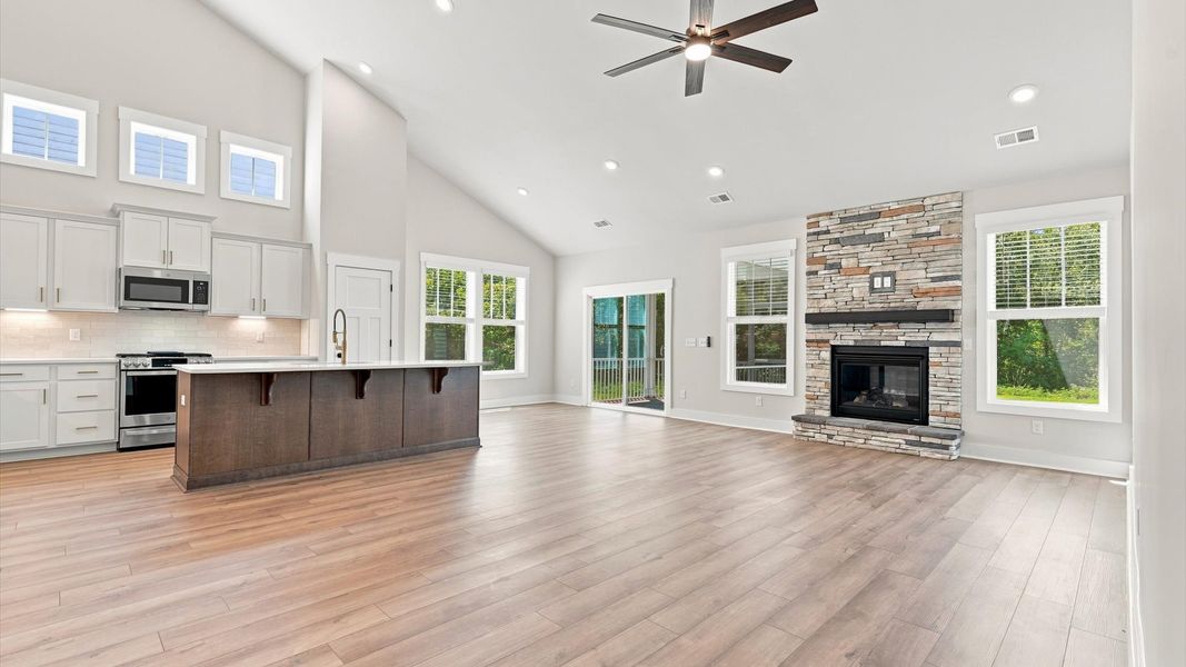 Highly skilled craftsmanship and modern elegance meet in this family room with soaring ceilings