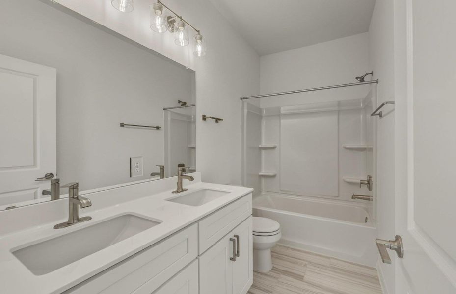 Furnished interior view inside a new home in Crosswinds, Kyle (Image 8).