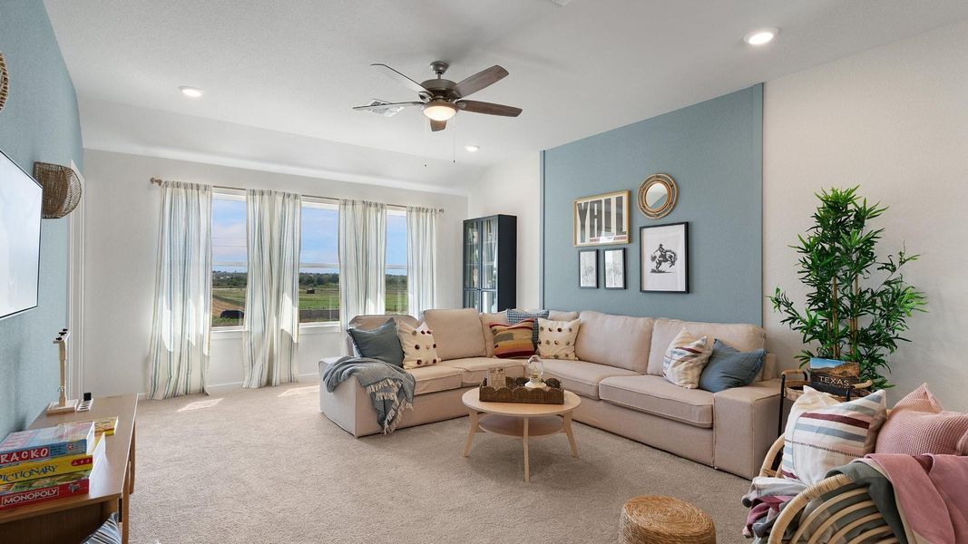 Unwind in this generously proportioned living area, featuring numerous windows and ample recessed lighting. Unwind in this generously proportioned living area, featuring numerous windows and ample recessed lighting.