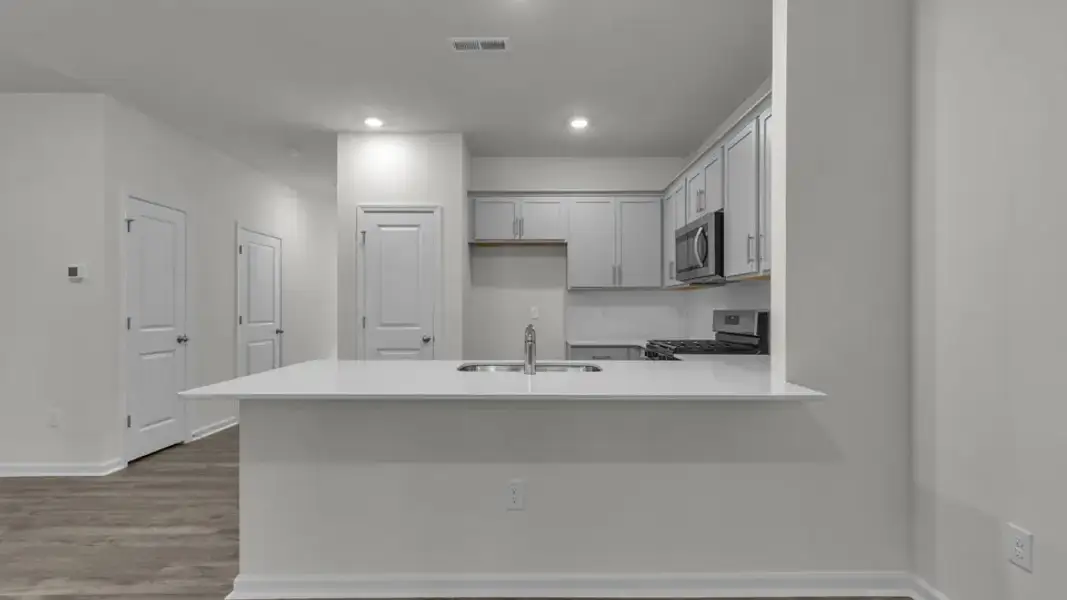 Furnished interior view inside a new home in The Townes at Prestleigh, Wake Forest (Image 8).