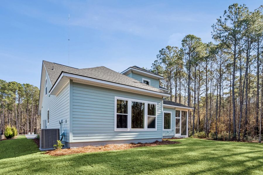 Exterior details and patio area of a home in Hidden Ponds Reserve, Awendaw (Image 24).