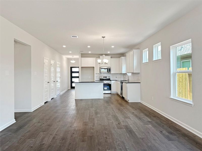The Kettering II- Family Room into the Kitchen. Home under construction. Sample floor plan photo used for illustrative purposes only. Upgrades, selections options, windows and colors may vary. The Kettering II- Family Room into the Kitchen. Home under construction. Sample floor plan photo used for illustrative purposes only. Upgrades, selections options, windows and colors may vary.