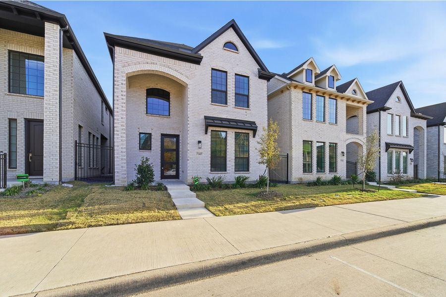 Front exterior of a new home in Craig Ranch, McKinney, TX, highlighting curb appeal (Image 21). Front exterior of a new home in Craig Ranch, McKinney, TX, highlighting curb appeal (Image 21).