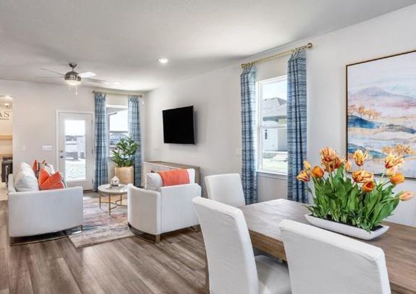 Dining room with wood finished floors, ceiling fan, plenty of natural light, and recessed lighting Dining room with wood finished floors, ceiling fan, plenty of natural light, and recessed lighting