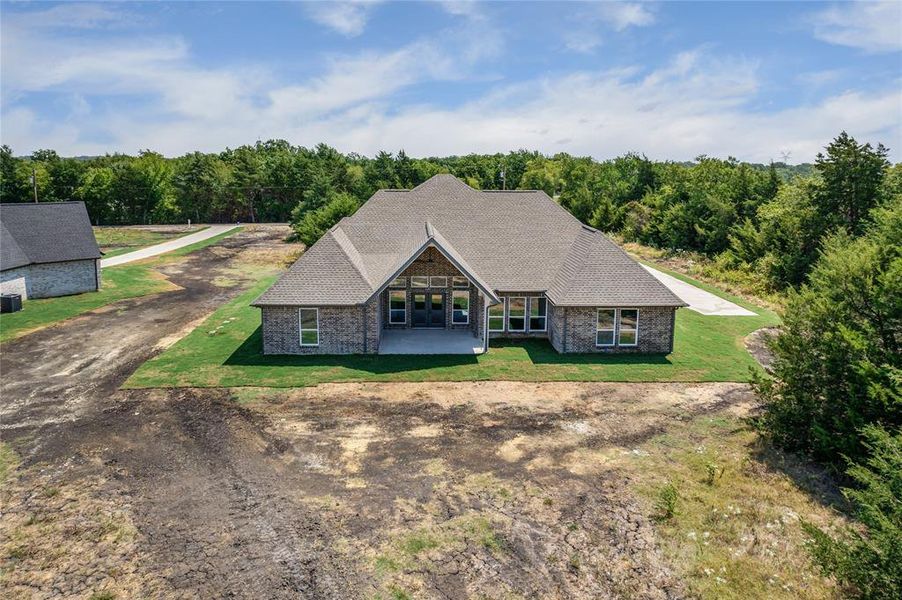 Front exterior of a new home in , Brashear, TX, highlighting curb appeal (Image 19). Front exterior of a new home in , Brashear, TX, highlighting curb appeal (Image 19).