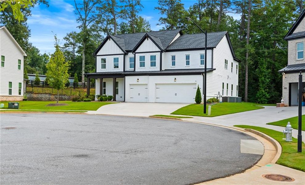 Front exterior of a new home in , Marietta, GA, highlighting curb appeal (Image 25).