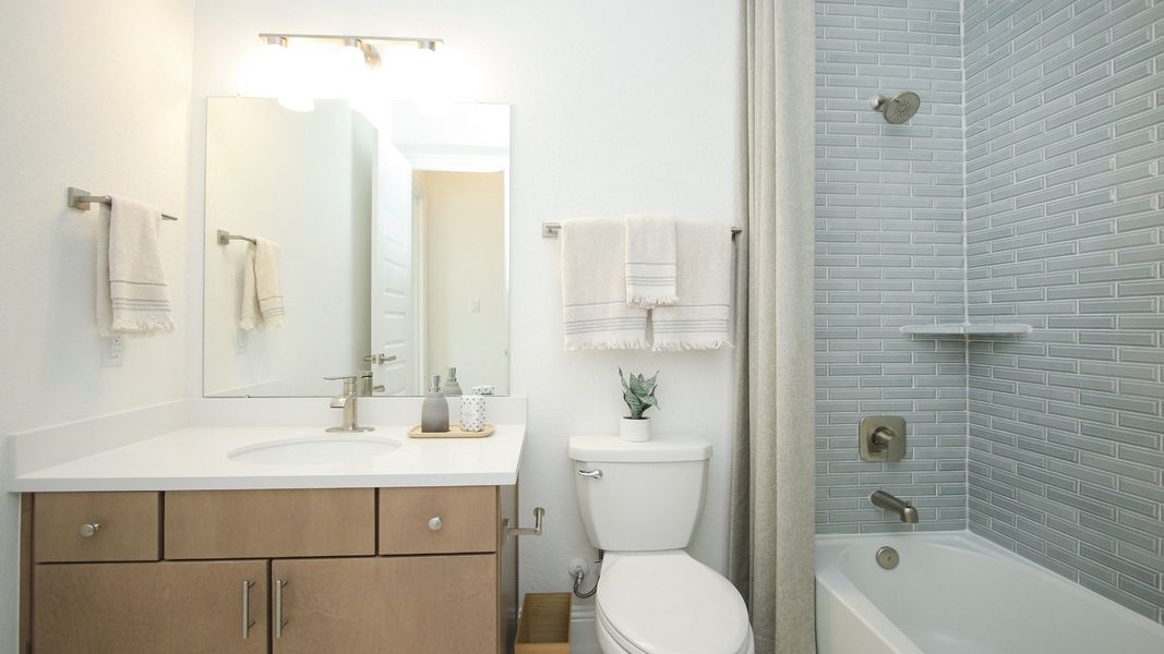 Representative furnished interior of a home built from the Juniper by Brightland Homes in Sunterra, Katy (Image 13).