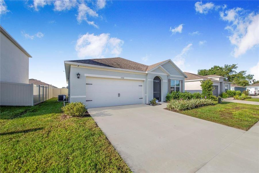 Front exterior of a new home in Bradbury Creek, Haines City, FL, highlighting curb appeal (Image 22).