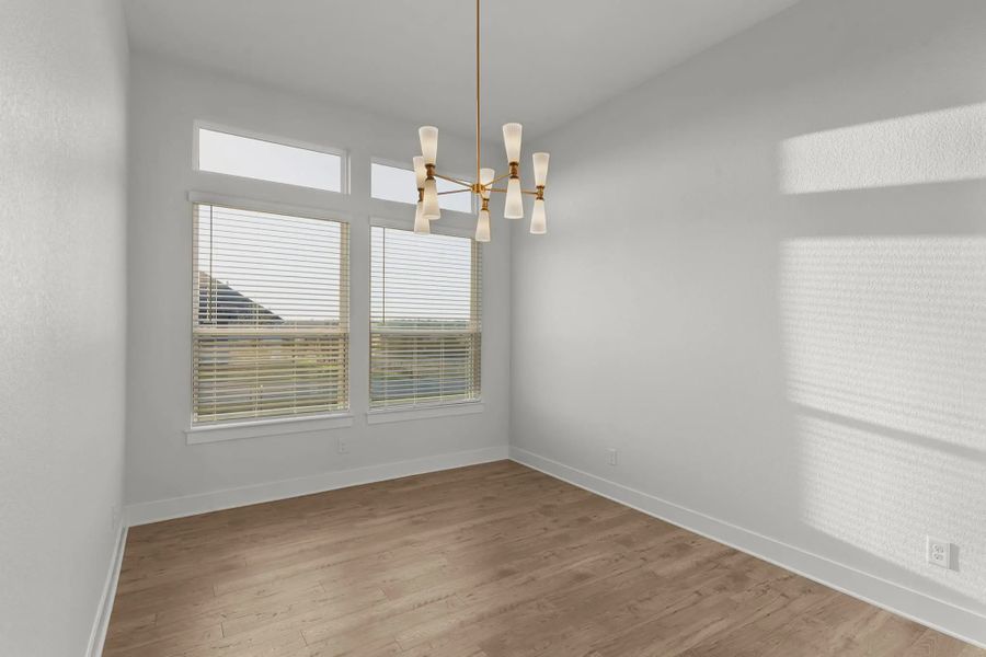 Representative unfurnished interior of a home built from the Merritt by Chesmar Homes in Feathergrass, Fulshear (Image 10).