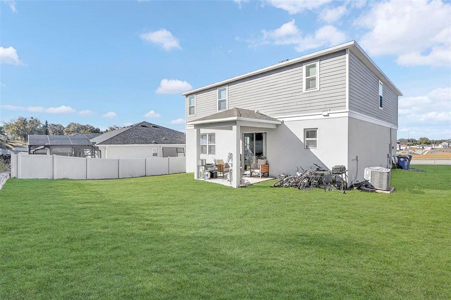 Exterior details and patio area of a home in The Reserve at Lake Ridge, Minneola (Image 30).