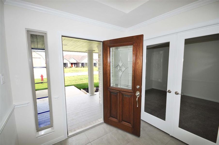 Enter through an attractive triple pane front door into a real foyer.