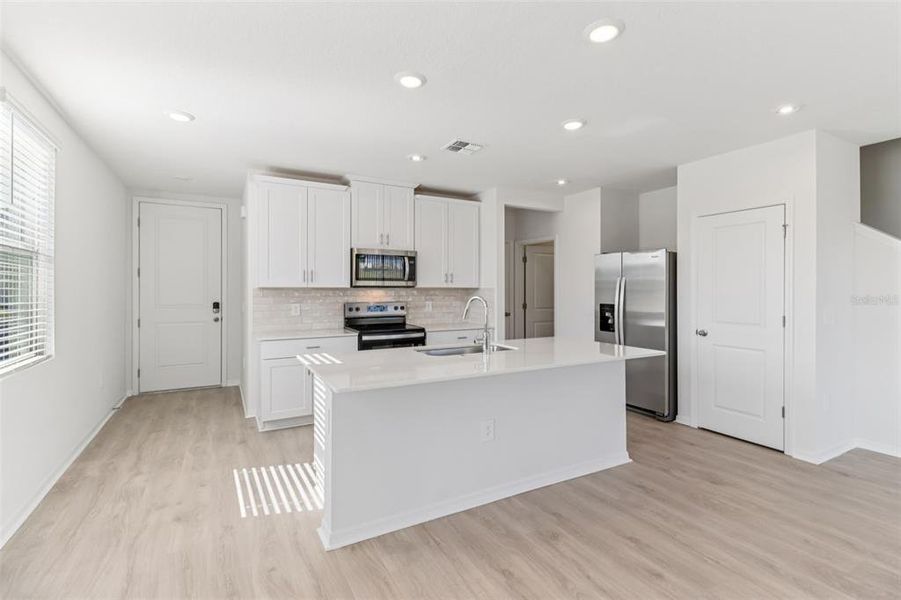 Furnished interior view inside a new home in The Reserve at Hammock Oaks Townes, Lady Lake (Image 8).