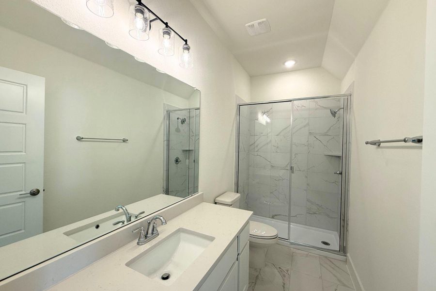 A well-appointed bathroom with a spacious vanity and a large, modern shower. A well-appointed bathroom with a spacious vanity and a large, modern shower.