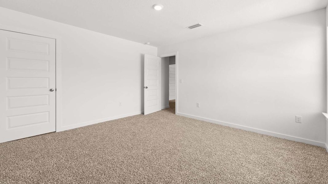 Spacious, unfurnished interior of a new home in Magnolia at the Bluffs Phase 3, Freeport (Image 15).