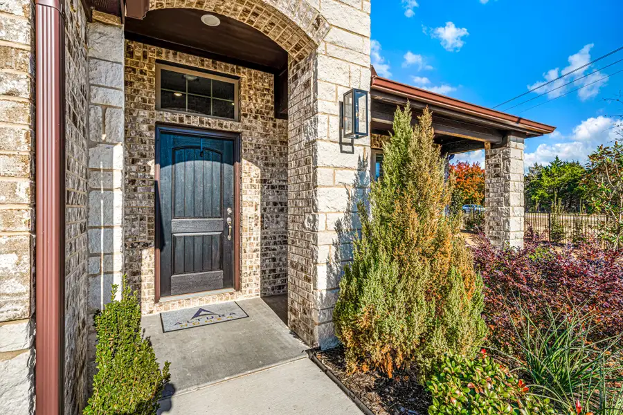 Exterior details and patio area of a home in Fox Landing, Caddo Mills (Image 3).