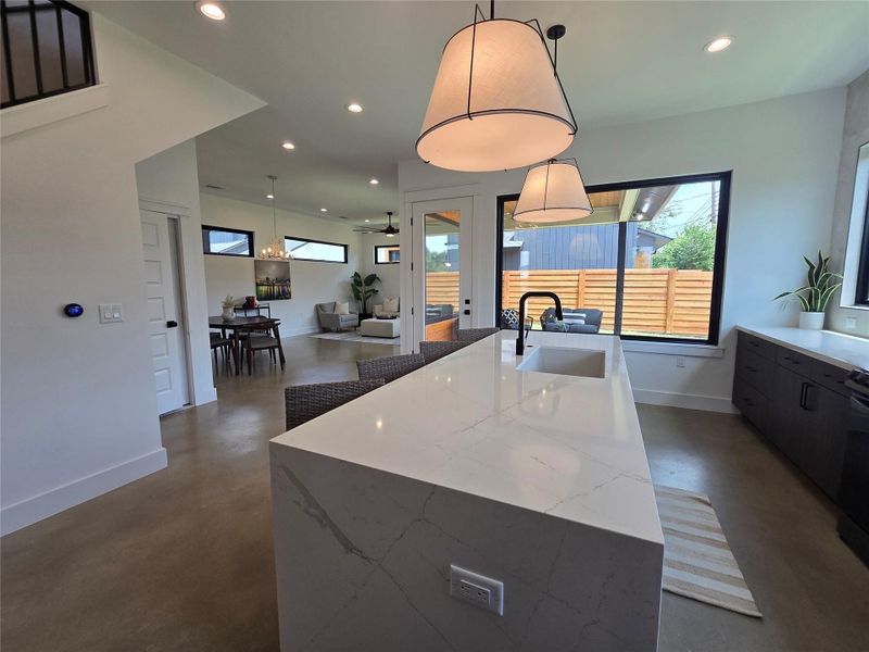 Huge island in the kitchen, lots of windows throughout, and all open and easily accessible from the main living area.