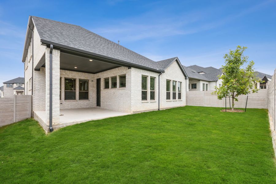 Covered Patio in the Da Vinci II home plan by Trophy Signature Homes – REPRESENTATIVE PHOTO