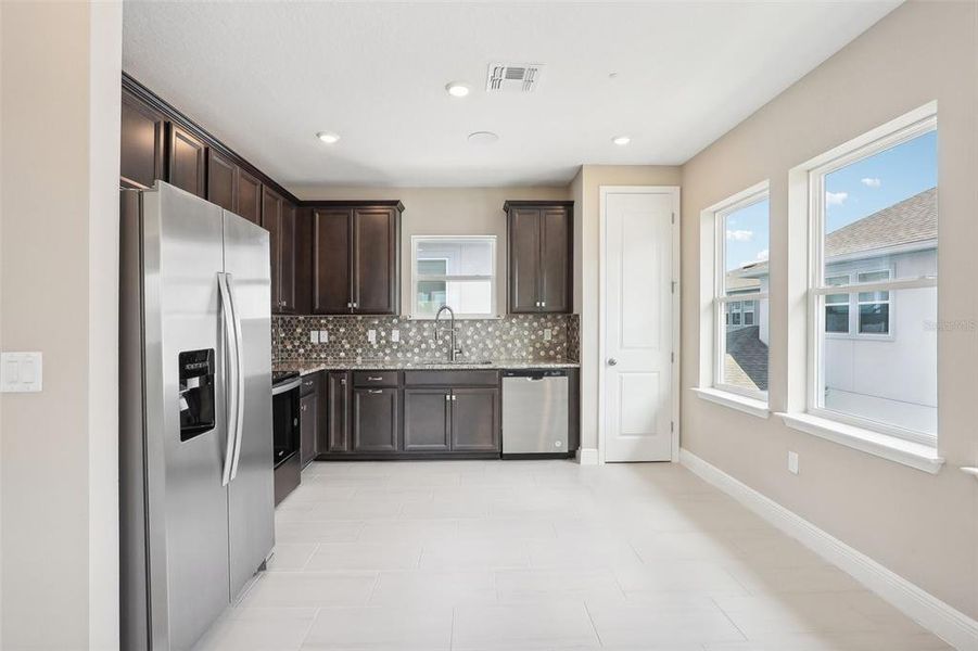Furnished interior view inside a new home in Laureate Park, Orlando (Image 9).