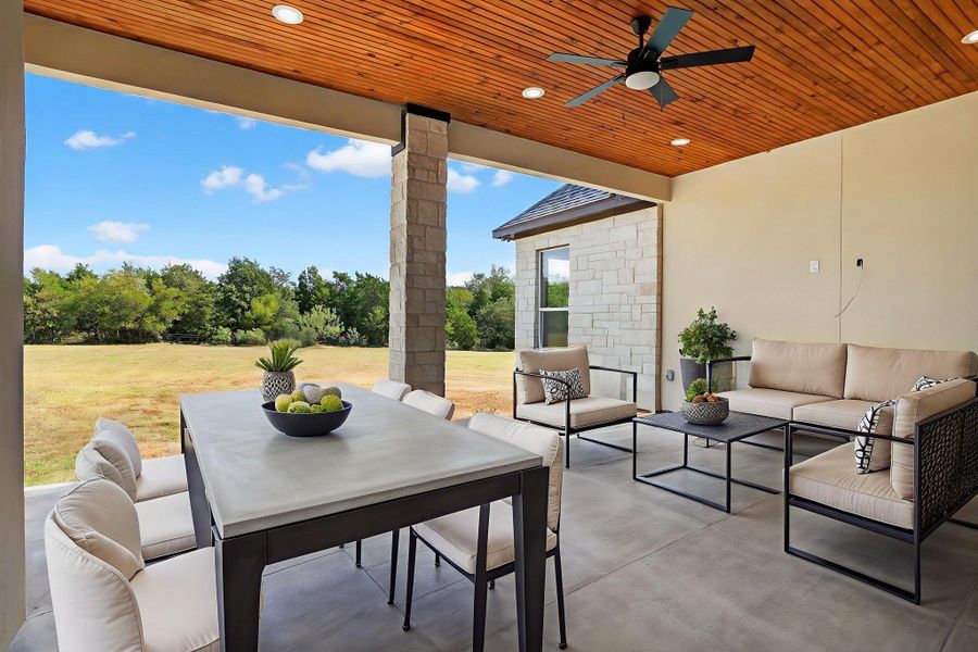 View of patio / terrace featuring outdoor dining area, an outdoor living space, and a ceiling fan View of patio / terrace featuring outdoor dining area, an outdoor living space, and a ceiling fan