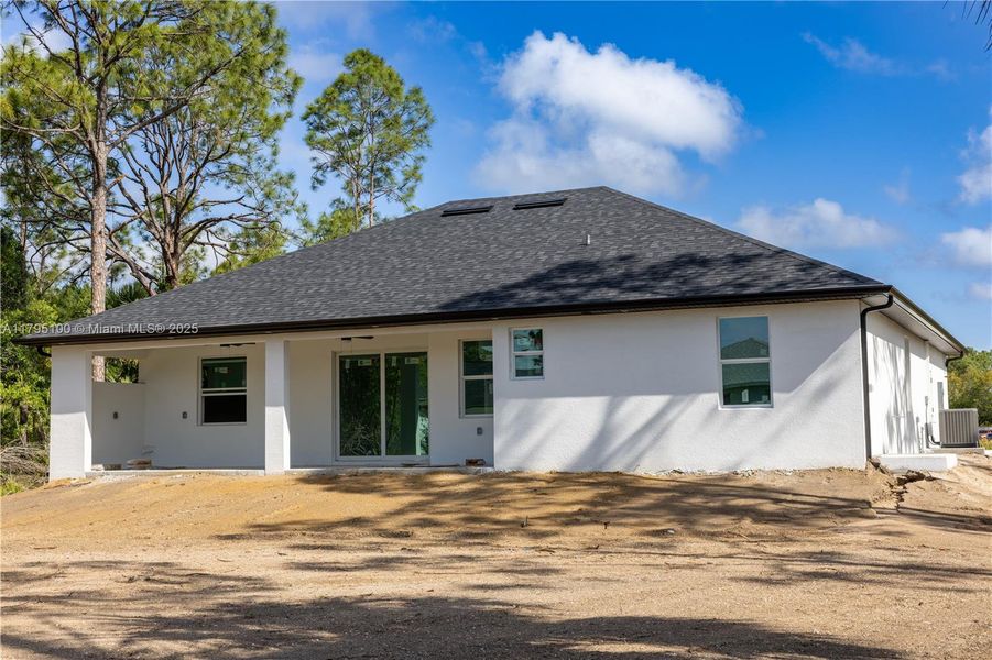 Front exterior of a new home in , Lehigh Acres, FL, highlighting curb appeal (Image 14).