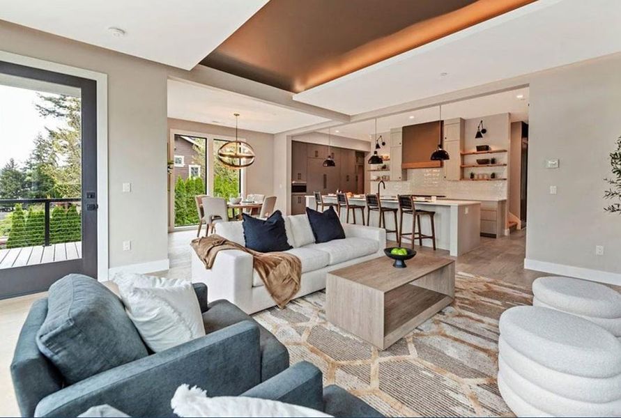 Living area with baseboards and light wood-type flooring