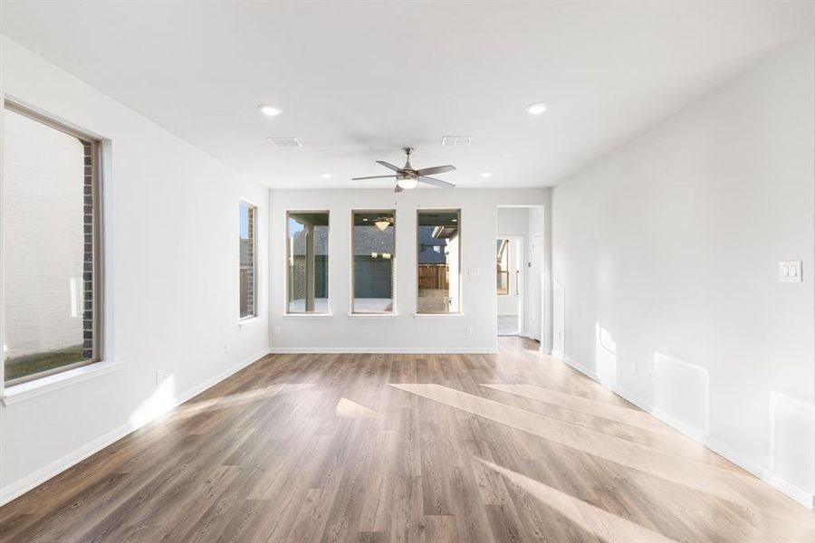 With a wall of windows looking out to your back yard, this family room offers a warm and inviting place to gather.