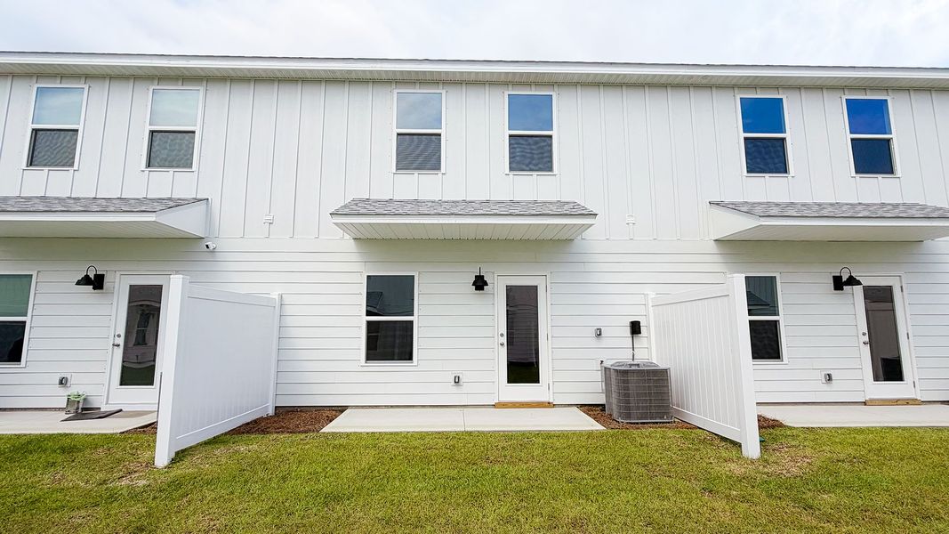 Exterior details and patio area of a home in Salt Creek Townhomes at Mexico Beach, Mexico Beach (Image 4).