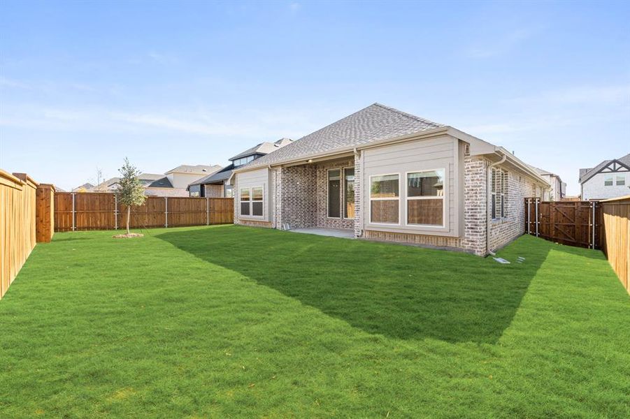 Exterior details and patio area of a home in Creekview Meadows, Pilot Point (Image 3).