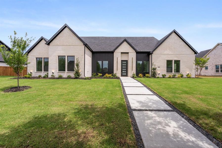 Front exterior of a new home in , Forney, TX, highlighting curb appeal (Image 19).