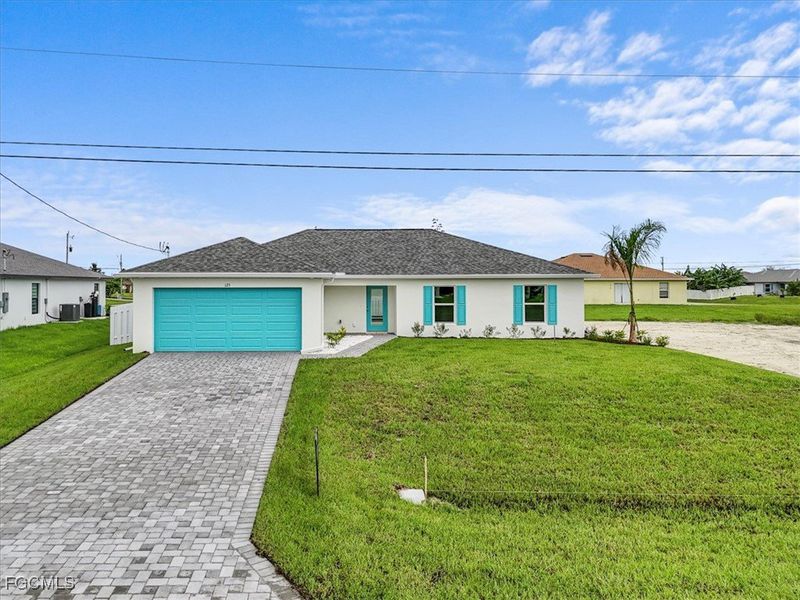 Front exterior of a new home in Cape Coral, Cape Coral, FL, highlighting curb appeal (Image 20). Front exterior of a new home in Cape Coral, Cape Coral, FL, highlighting curb appeal (Image 20).