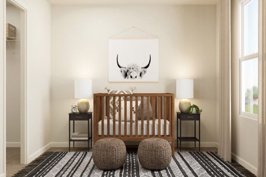 A room with a bed and a table with a lamp on it.