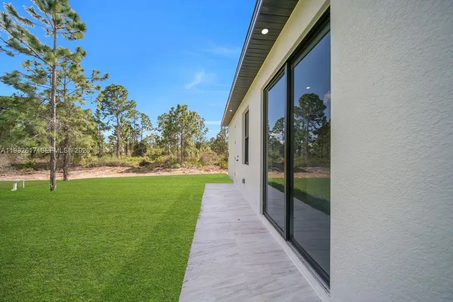 Exterior details and patio area of a home in , Lehigh Acres (Image 4).